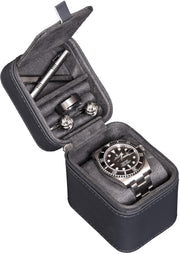 Open single-watch travel case with a watch on the cushion and accessories in the lid