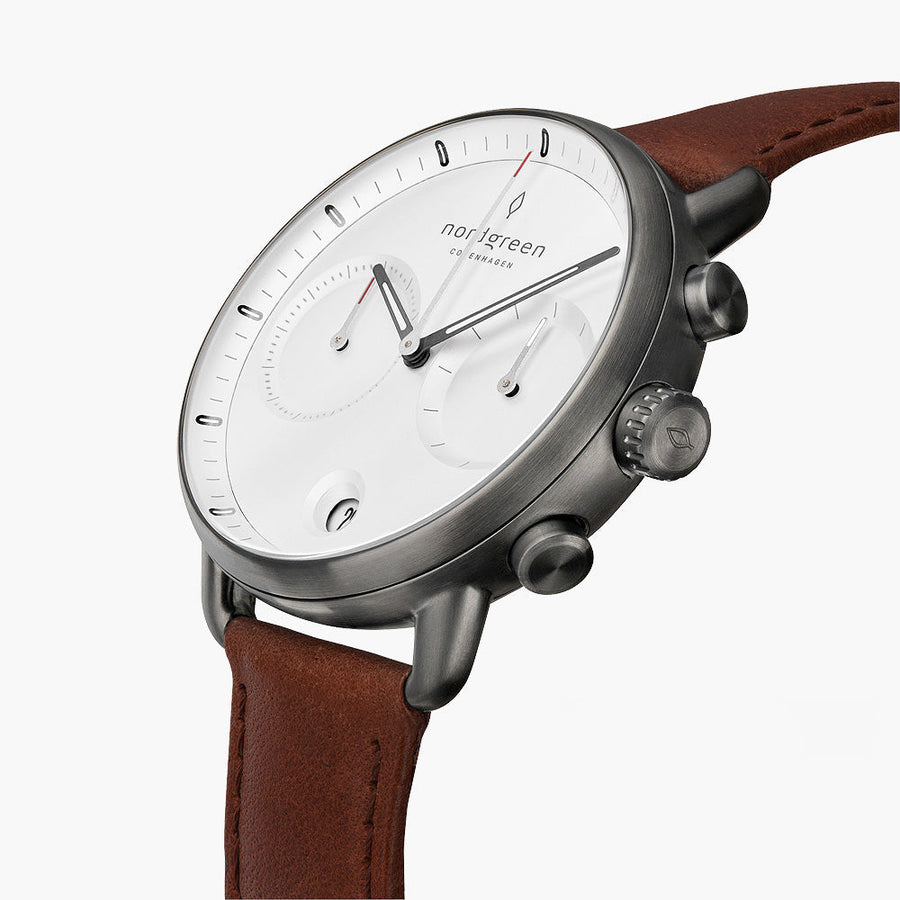 Angled view of the white dial, two subdials and gunmetal pushers.