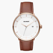 Straight-on look at the white dial and rose gold-tone case with its brown strap.