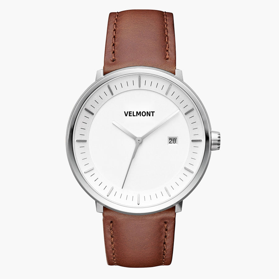 Front view of a silver-tone watch with a white dial on a brown strap.