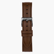 Brown strap with tonal stitching and a gunmetal pin buckle.