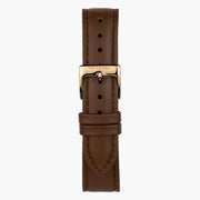 The brown strap shown on its own with a rose gold-tone pin buckle.