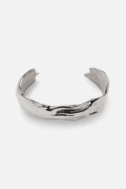 Silver-tone sculpted wave cuff bracelet, front view on a light background