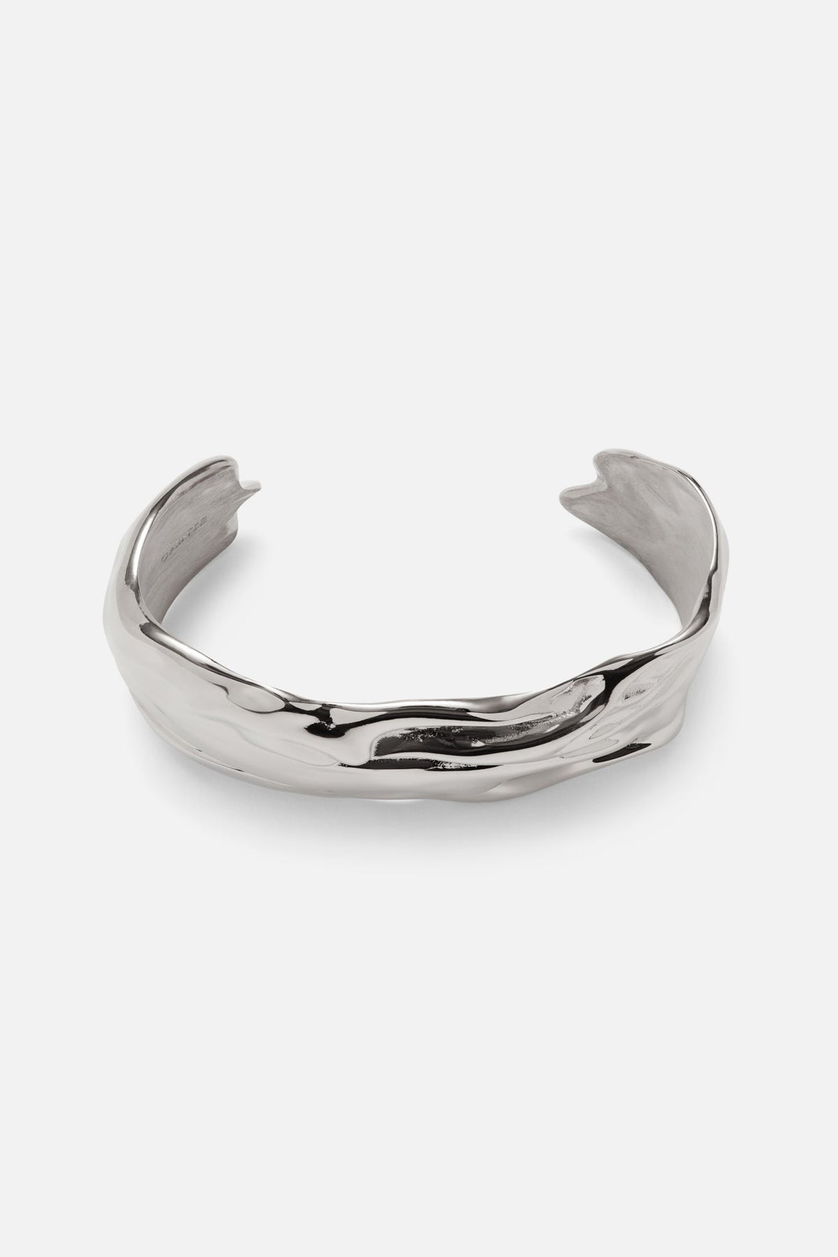 Silver-tone sculpted wave cuff bracelet, front view on a light background