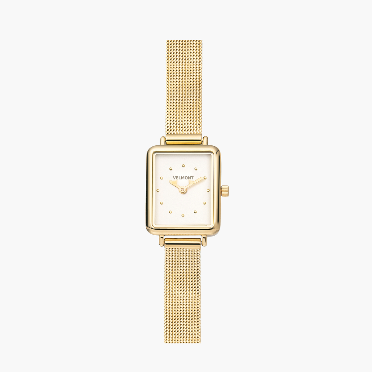 Small rectangular gold-tone watch with a white dial on a fine mesh strap.