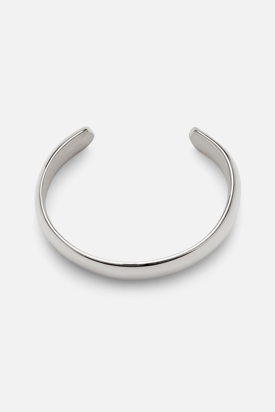 Silver-tone wide smooth cuff bracelet, front view on a light background