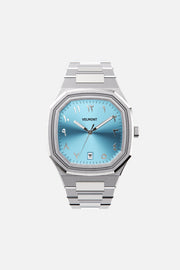 Front view of the octagonal watch with turquoise Arabic numeral dial on its integrated bracelet