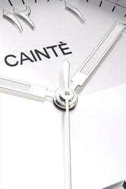 Macro view of the white Arabic numeral dial and polished hands