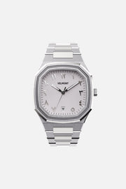 Front view of the octagonal watch with white Arabic numeral dial on its integrated bracelet