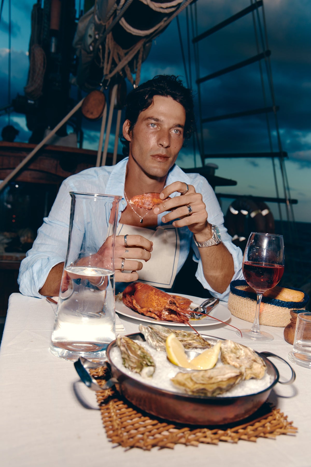 Seafood dinner on deck with the watch on the wrist