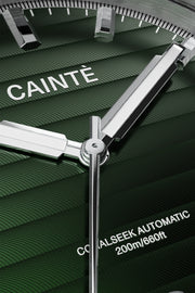 Close-up of the green horizontal-textured dial and polished hands