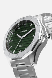 Three-quarter view of the faceted, numbered bezel and green dial
