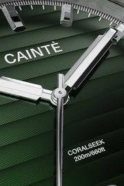 Close-up of the green ridged dial and polished hands