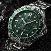 Green watch on wet stone