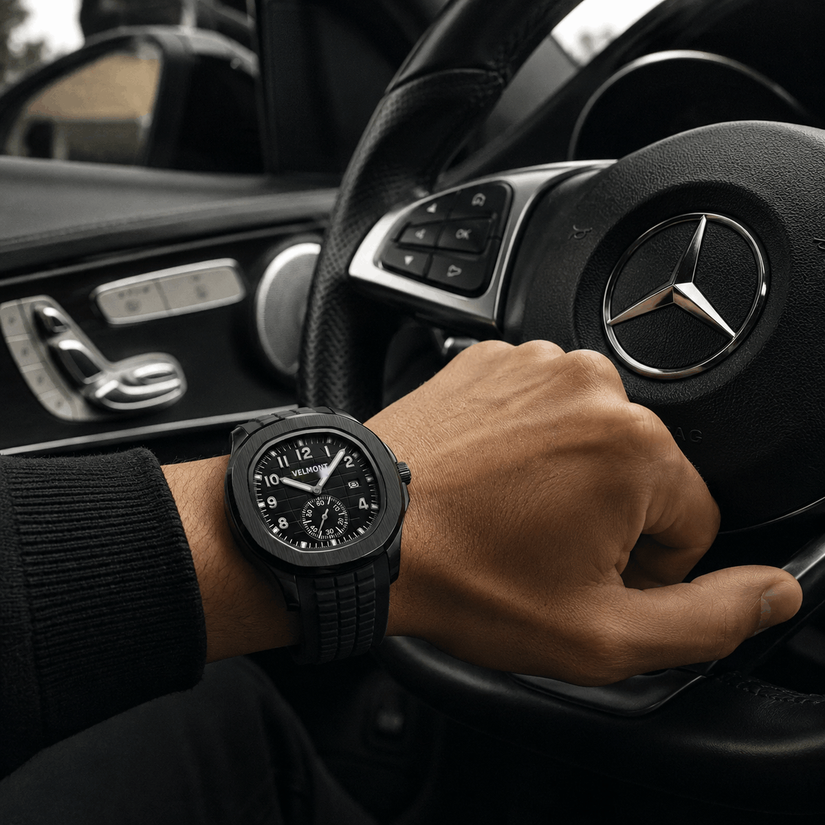 All-black rubber strap watch worn while driving