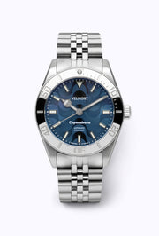 Blue wave dial watch with black and steel bezel on a bracelet