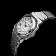 Small cushion-case watch at an angle on a black background