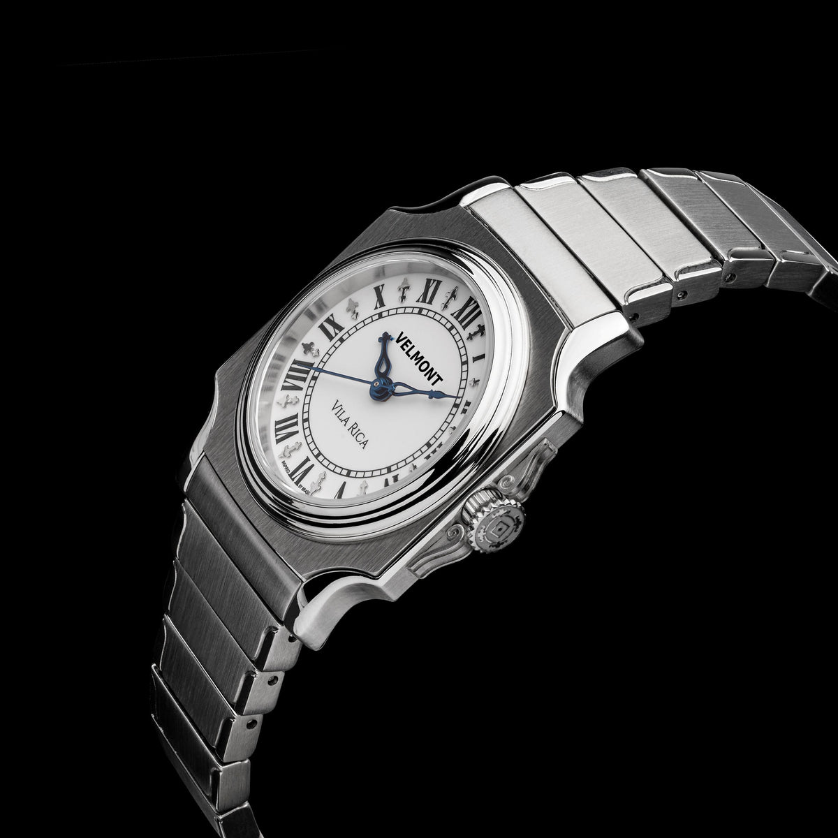 Small cushion-case watch at an angle on a black background