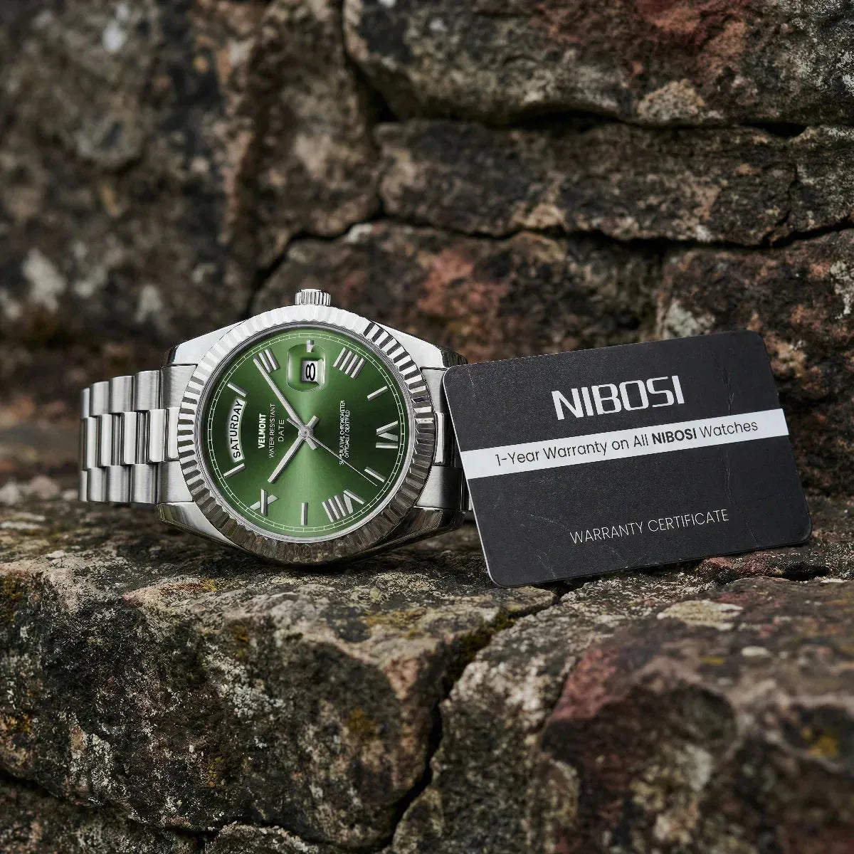 Steel version with green dial on a rock (other model)