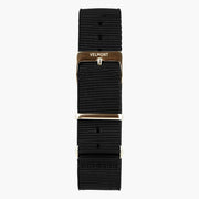 Black woven strap with a light metal buckle and keepers, laid flat.