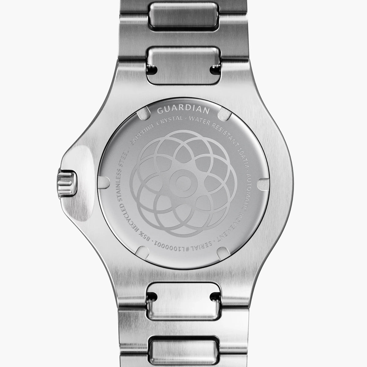 Solid case back in silver tone with an engraved rosette pattern.