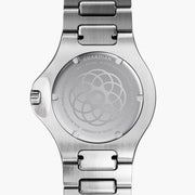 Silver-tone case back engraved with a geometric floral pattern, bracelet attached.