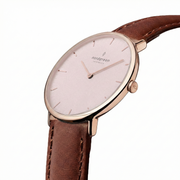 Angled view of the slim rose gold-tone case and pink dial.