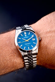 Blue dial watch on the wrist