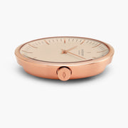 Side profile of the rose gold-tone case showing the engraved crown.