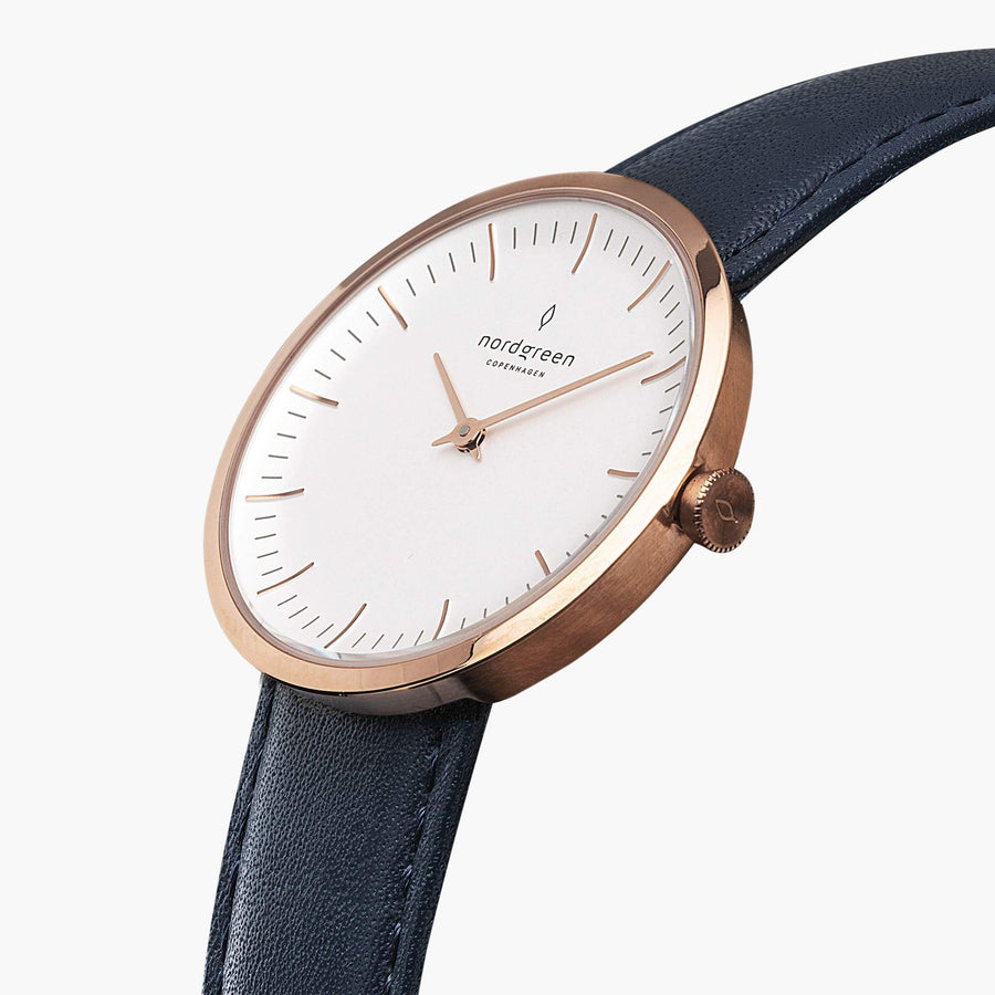Angled view of the slim rose gold-tone case against a navy strap.