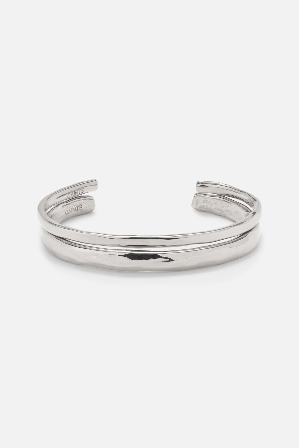 Silver-tone double band cuff bracelet, front view on a light background