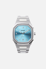 Front view of the octagonal watch with turquoise Arabic numeral dial on its integrated bracelet