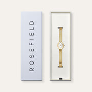 Gold-tone oval watch in its gift box