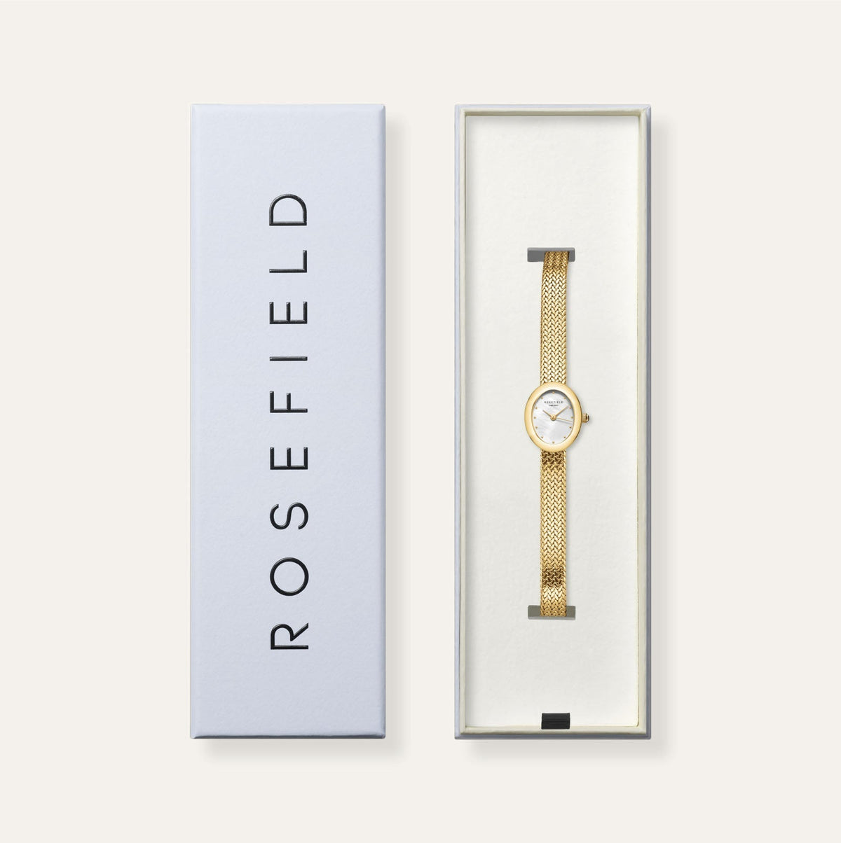 Gold-tone oval watch in its gift box