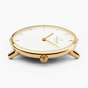 Side profile of the thin gold-tone case with slim lugs.