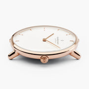 Low angle on the thin rose gold-tone case, showing slender lugs and the crown.