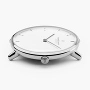 Profile shot of the slim silver-tone case with its tubular lugs.