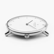 Silver-tone case from a low angle, showing slim lugs and the crown.