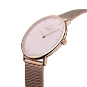 Angled view of the slim case and soft pink dial.