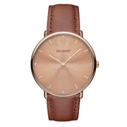 Watch with a rose gold-tone sunburst dial and matching case on a caramel brown strap.