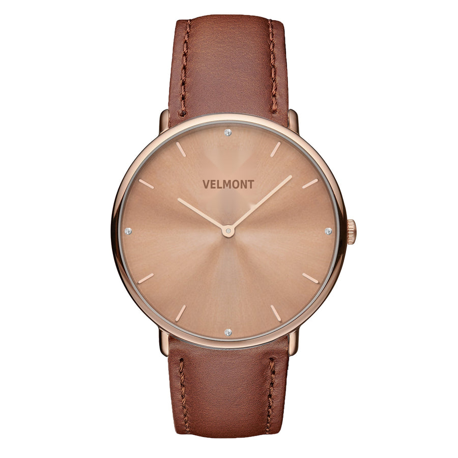 Watch with a rose gold-tone sunburst dial and matching case on a caramel brown strap.
