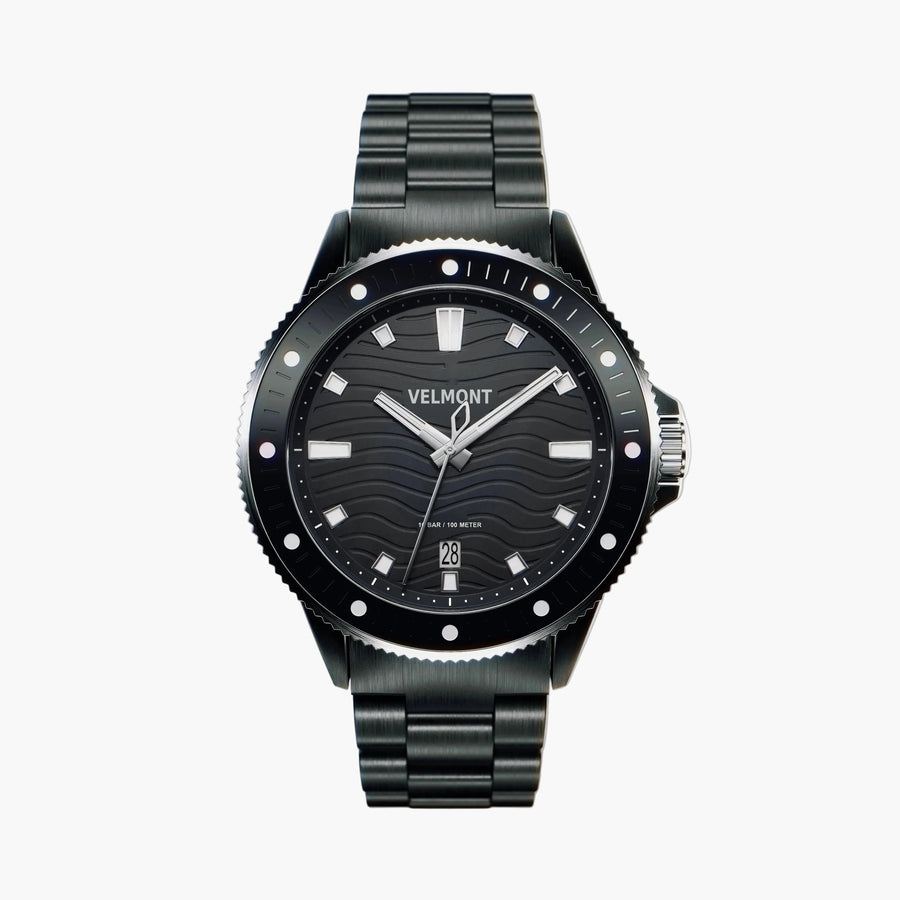 Black diver-style watch with a wave-textured dial on a black link bracelet.