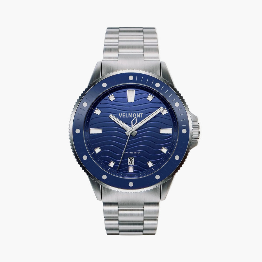 Diver-style watch with a blue wave dial, blue bezel and silver-tone link bracelet.