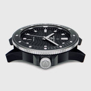 Side profile showing the coin-edge bezel and silver-tone screw-style crown.
