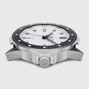 Side profile showing the coin-edge bezel and large silver-tone crown.