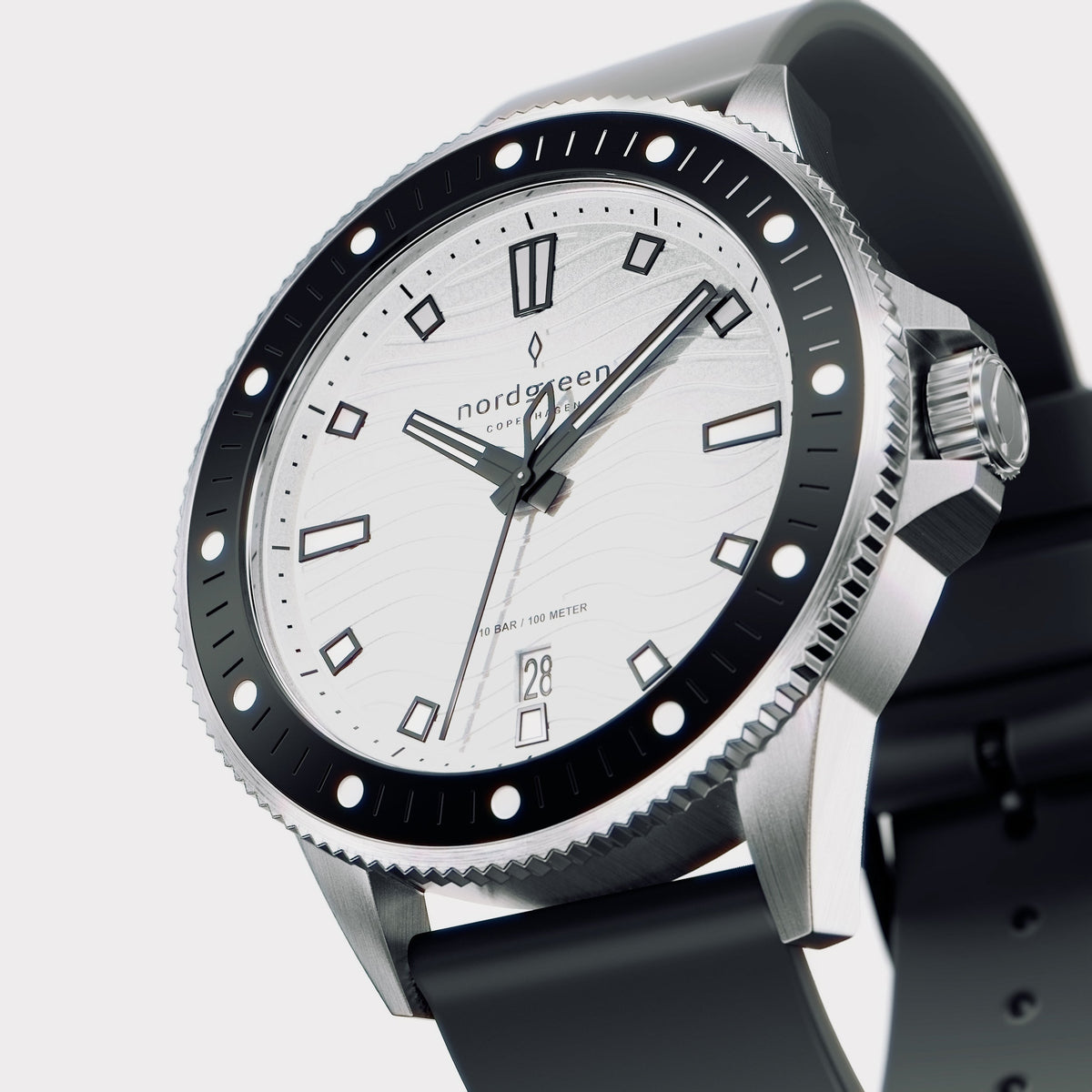 Angled view of the silver-tone case with black bezel and white dial.