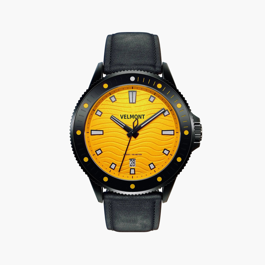 Black diver-style watch with a yellow wave-patterned dial on a matte black strap.