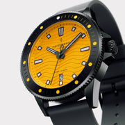 Angled view of the black case and bezel around the bright yellow dial.