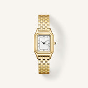Gold-tone dress watch with white dial and black Roman numerals, front view