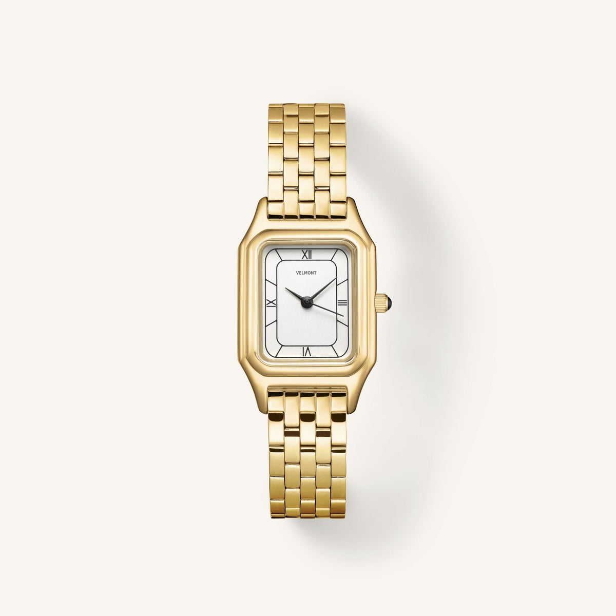 Gold-tone dress watch with white dial and black Roman numerals, front view